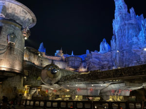 A photograph of the Millennium Falcon at Star Wars: Galaxy's edge at Disneyland at night